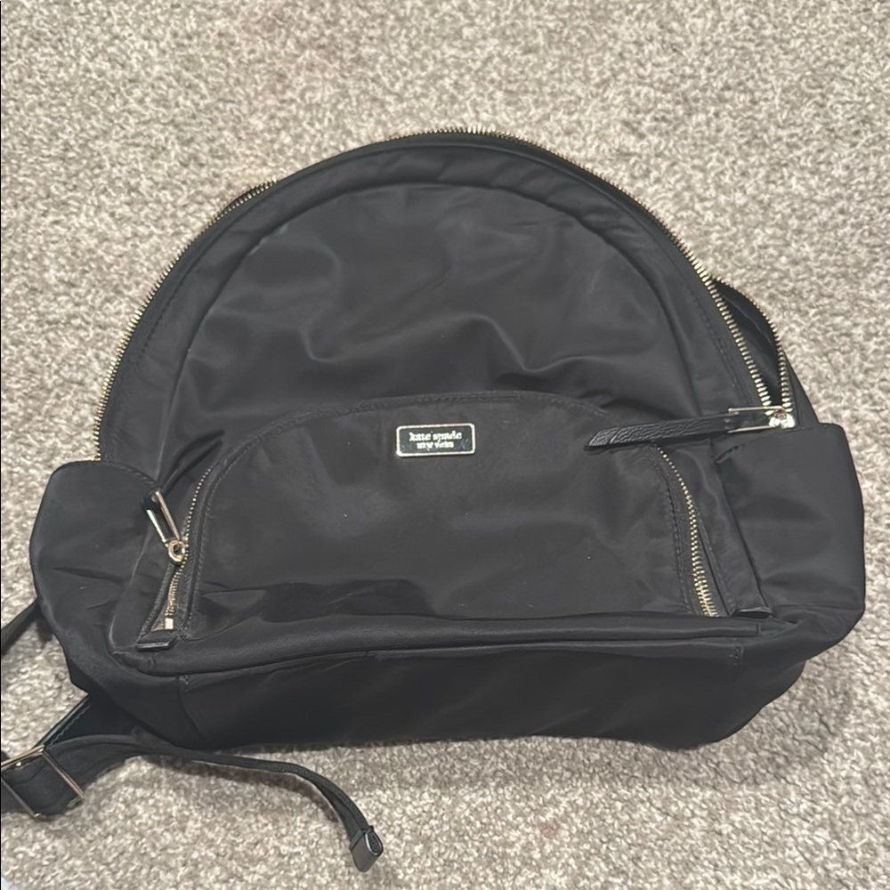 Kate Spade Black Backpack with Sleek Curved Design